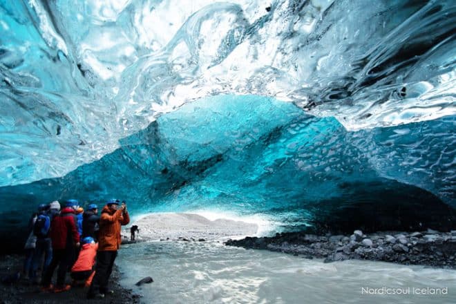 Crystal blue ice cave under a glacier