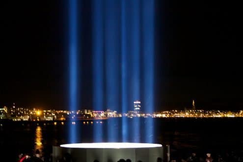 Reykjavik through the beams of the Imagine Peace Tower.