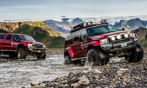 Two Jeeps crossing a river in the Icelandic Highlands.