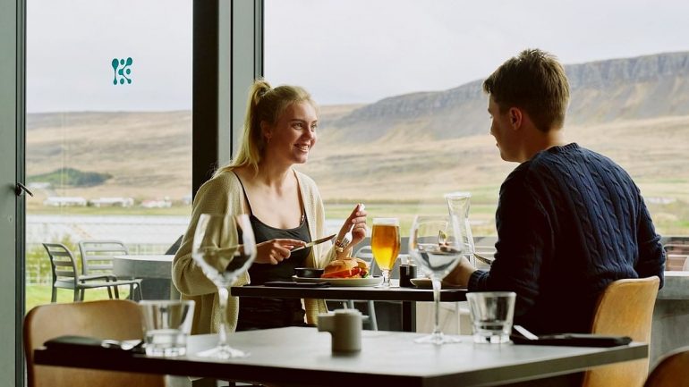 A couple eating at a restaurant at Krauma Spa in West Iceland